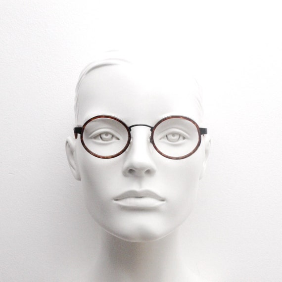 90s vintage oval glasses made in Italy. Black metal frame encasing tortoise insert optical frames. Prescription eyeglasses. RX Spectacles