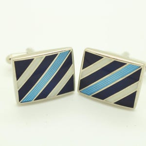 Vintage square cuff links made in England. Solid metal construction with diagonal enamel stripes in black, white and blue. NOS