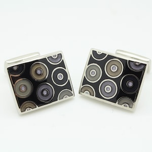 Vintage rectangular cuff links made in England by Berend De Witt. Solid metal construction in black with grey enamel circles. NOS