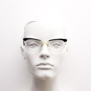 50s vintage pointed cat eye glasses. Womens crystal acetate cat eye optical frame with black brow and arms. Prescription RX eyeglasses