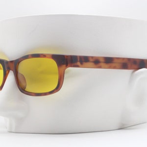 90s vintage rectangular sunglasses. Matt tortoise 60s style mod frame with psychedelic canary yellow lenses. BNWT. 80s. NOS.