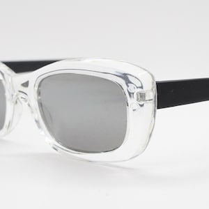 90s vintage stark two tone sunglasses. 60s mod style rectangular transparent frame with black gloss arms and lenses. Unused NOS