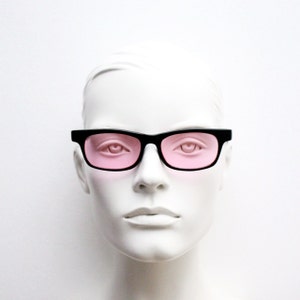 80s vintage rectangular sunglasses. Black wide low profile wayfarer style frame with bright pink lenses. Mens Psychedelic mod. Unused NOS