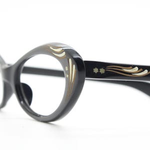 50s vintage oval cat eye glasses. Womens black acetate cat eye optical frame with white and gold embellishment. Prescription spectacles. NOS