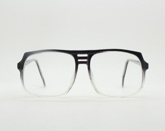 Gafas cuadradas grandes vintage de los años 70 de RPL London. Montura de acetato con degradado negro a cristal. Gafas graduadas.
