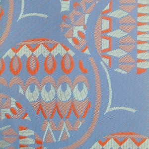 70s vintage necktie made in Germany by Duka. Blue and iridescent red abstract big circles pattern neck tie. Mens NOS cravat