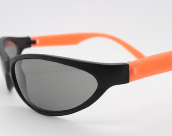 80s vintage wraparound shield sunglasses. Aerodynamic black matt sport visor with fluorescent orange dayglo arms. Y2K. 2000s