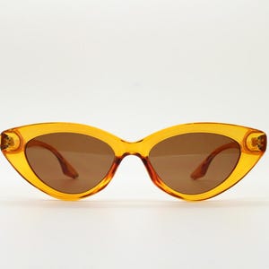 90s vintage oval cat eye sunglasses. Transparent amber 50s design cateye. Rockabilly pin up orange cateyes. Unused NOS