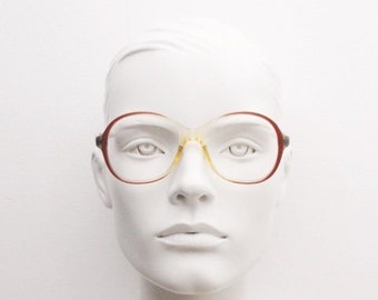 70s vintage round eye glasses made in the UK. Womens yellow crystal acetate optical frame with red ombre outline. Prescription RX spectacles