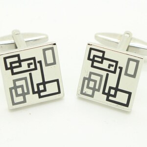 Vintage square steel cuff links made in England. Solid metal flat surface with black and grey abstract squares pattern. NOS