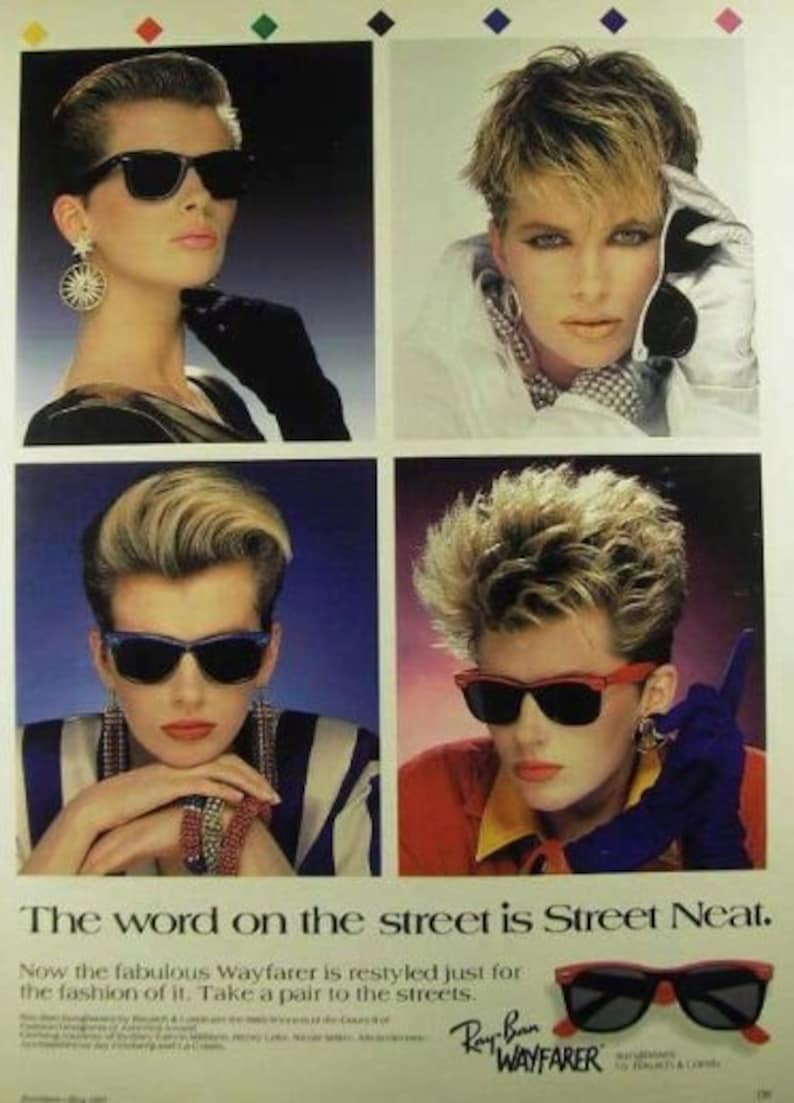 May include: A vintage print ad for Ray-Ban Wayfarer sunglasses featuring four models wearing different styles of the sunglasses. The ad text reads "The word on the street is Street Neat. Now the fabulous Wayfarer is restyled just for the fashion of it. Take a pair to the streets. Ray-Ban Wayfarer."