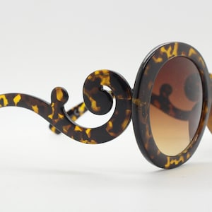 Y2K vintage oversized round sunglasses. Women&#39;s tortoise frame with graduating smoky lenses and swirling arms. Unused NOS. 2000s