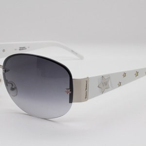 Vivienne Westwood vintage Y2K sunglasses model VW 57503. Black frameless graduated lenses with dazzling silver star arms. BNWT