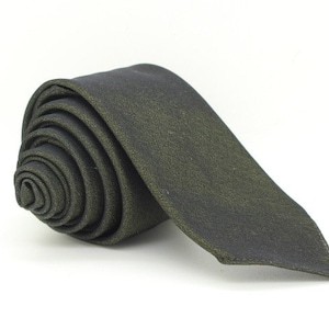 May include: A dark green and black tie with a subtle shimmer. The tie is rolled up and ready to be worn.