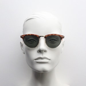 80s vintage cat eye sunglasses. Half frame tortoise brow line 50s design cateyes with green lenses. Unused NOS cateye