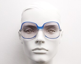 Okulary przeciwsłoneczne vintage z lat 70., oversize'owe, kwadratowe, z octanu. Dwukolorowa, elegancka, smukła, niebiesko-szara oprawka z jasnymi, przydymionymi, stopniowanymi soczewkami.