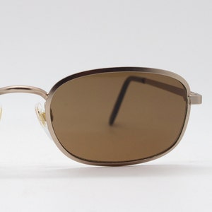 90's vintage rectangular sunglasses. Matt satin gold frame with brown lenses. Unused NOS