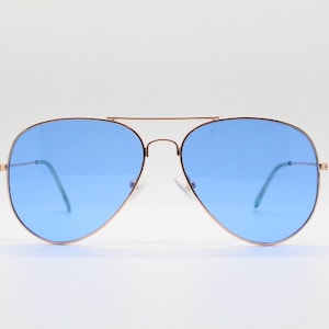 Y2K vintage aviator sunglasses. Sky blue lenses in slim lightweight gold teardrop frame. Pilot aviators. 70s