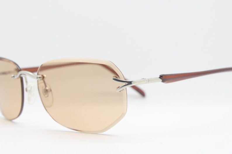 Y2K vintage sunglasses. Frameless light brown bevelled edge lenses with chrome connectors and slender arms. 2000s unused NOS. BNWT image 2