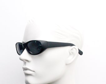 90s vintage sunglasses. Black matt curved 60s style wraparound frame with dark lenses. BNWT. Unused NOS