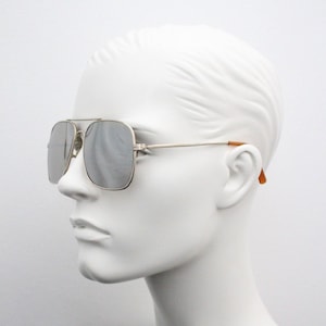 Linda Farrow 70s vintage square aviator sunglasses model 13/6110. Gold metal frame with silver glass mirror lenses. Luxe Gallery Projects