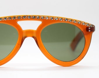 60s vintage diamante sunglasses. Showstopping transparent amber frame with curved big rhinestone brow. Womens mod 1960s