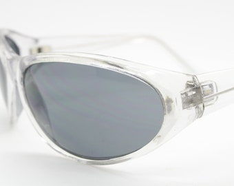 90s vintage futuristic bug eye sunglasses. Transparent crystal wrap around shield frame with black lenses. 2000s. Y2K visor. Unused NOS