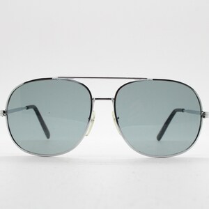 May include: Silver aviator sunglasses with gray lenses.