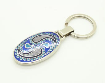 Vintage rectangular steel key ring made in England. Substantial solid metal base with enamelled paisley pattern in blue tones. NOS keychain