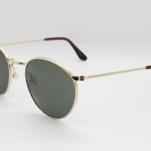 90s vintage refined aviator sunglasses. 60's style round metal frame with dark green lenses. BNWT. Unused NOS image 4