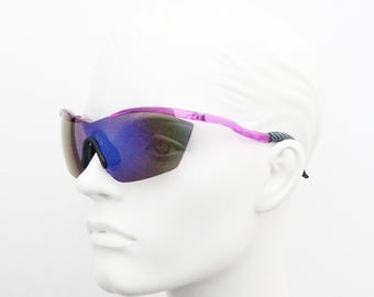 Y2K vintage visor shield sunglasses. Evil frameless petrol colourburst monolens on fluorescent pink brow. 2000s club kids. NOS
