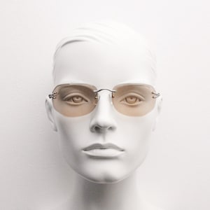 Y2K vintage sunglasses. Frameless light brown bevelled edge lenses with chrome connectors and slender arms. 2000s unused NOS. BNWT image 1