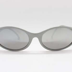 90s vintage NOS wraparound sunglasses with matt silver curved frame and mirror lenses. BNWT