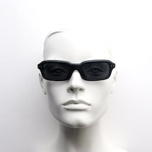 90s vintage black matt sunglasses. NOS 60s design rectangular slim frame with black lenses. BNWT
