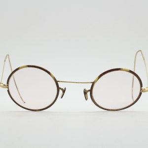 20s vintage glasses. Tortoise lens surrounds on a gold Windsor optical frame with coiled arms. Prescription eyeglasses. 30s RX spectacles
