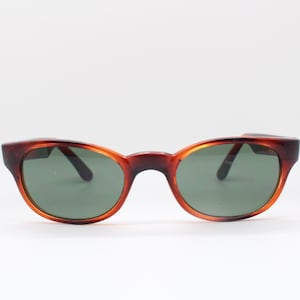 60s vintage cat eye sunglasses. Mottled amber and brown low profile beatnik cateye acetate frame with green lenses. BNWOT. Unused NOS. Mod