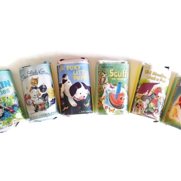 May include: A collection of vintage children's books with colorful illustrations. The titles include "Train Stories", "Three Little Kittens", "The Poky Little Pup", "Scuff the Tugboat", "Old Mother Hubbard", and "The Little Red Hen".