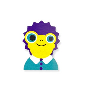May include: A yellow frog with purple spiky hair wearing a teal blue shirt with a white collar and two black buttons.