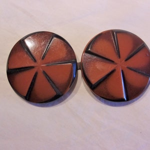 Great 1920s 1930s double sided plastic belt buckle in pinwheel design Medium size Celluloid