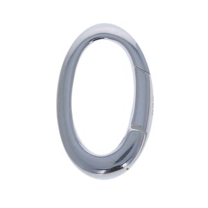 May include: A silver oval-shaped clasp with a hinged opening.