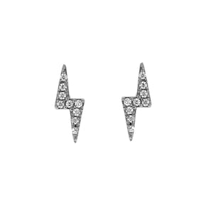 May include: A pair of silver lightning bolt stud earrings with clear cubic zirconia stones.