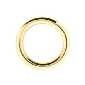 May include: A gold-colored metal jump ring.