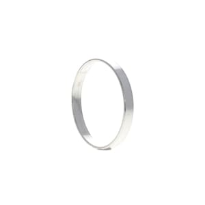 May include: A simple silver band ring.