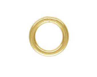May include: A gold jump ring, a small metal ring used for connecting jewelry pieces.