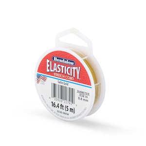 May include: A spool of Beadalon Elasticity stretch cord in satin gold. The packaging features the text Beadalon Elasticity Stretch Cord, Satin Gold, 16.4 ft, and a diameter of .032 in. The spool is white with a red accent and a barcode.