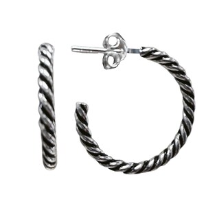 May include: A pair of silver hoop earrings featuring a twisted rope texture. The earrings have a polished finish with darkened recessed areas to highlight the spiral pattern. Each hoop includes a post and a butterfly clutch backing for secure wear.