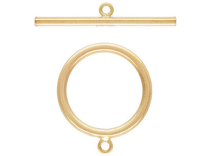 May include: Gold-toned metal toggle clasp with a round ring and a straight bar. The clasp is used for necklaces, bracelets, and other jewelry.