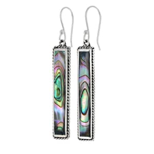 May include: Silver dangle earrings with a rectangular abalone shell inlay. The shell has a green, blue, and purple iridescent pattern.