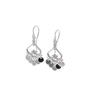 May include: A pair of silver dangle earrings featuring a heart-shaped frame with a decorative scrollwork center. Each earring is adorned with five small, circular silver discs that hang from the base, suspended by delicate silver chains.