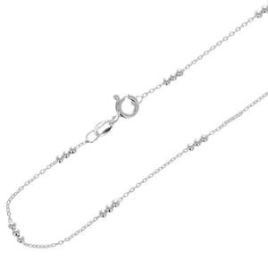May include: A silver chain necklace with small round beads.